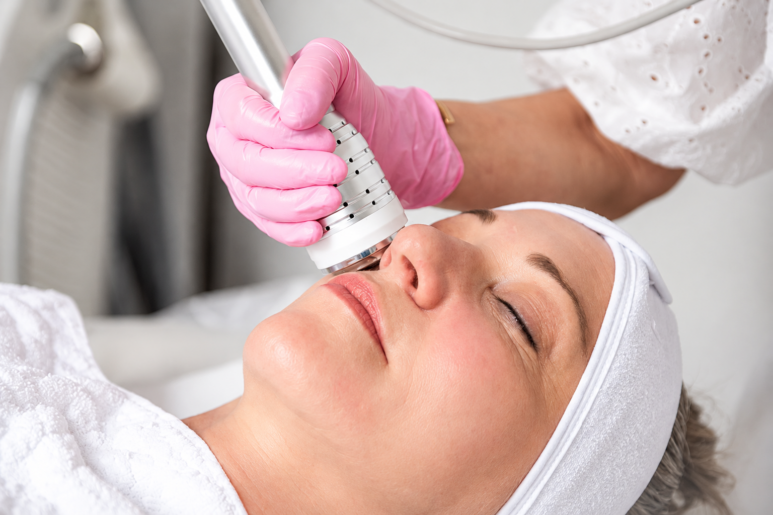 Illustrative image: A facial treatment in a calm neutral setting